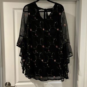 black flowy embroidered red mini dress with mesh cape sleeves
